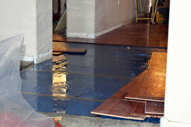 Professional Flood Damage Restoration technician working in Colgate, WI